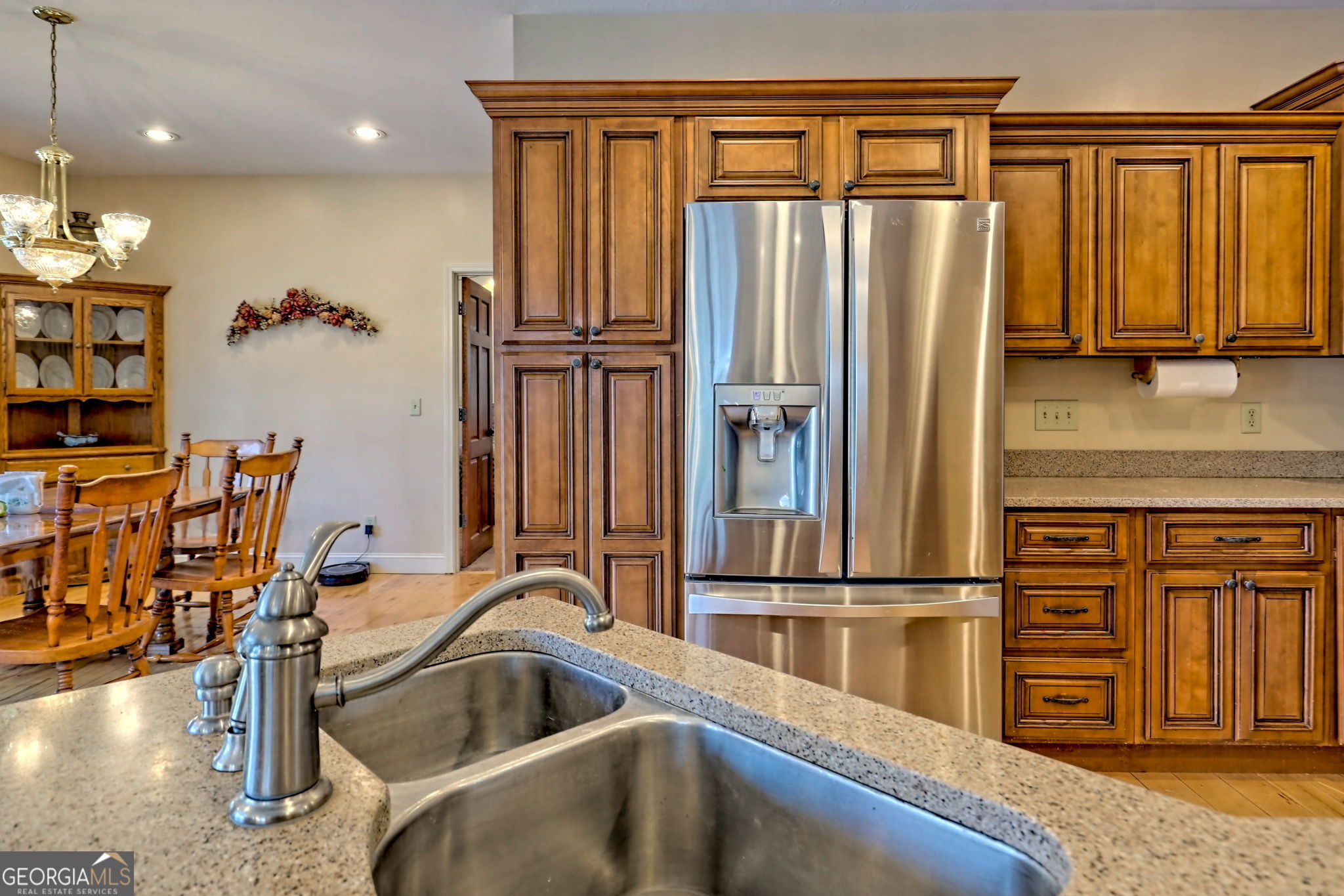 1068 Coleman River Road Clayton, GA 30525 - Photo 15 of 86 a kitchen with stainless steel appliances granite countertop a refrigerator and a sink