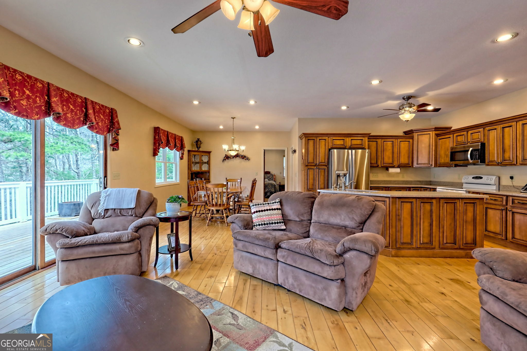 1068 Coleman River Road Clayton, GA 30525 - Photo 24 of 90 a living room with furniture kitchen view and a large window