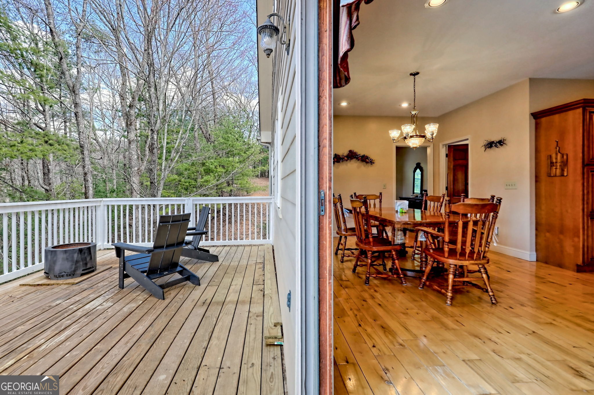1068 Coleman River Road Clayton, GA 30525 - Photo 34 of 90 a view of a dinning table and chairs on deck with wooden floor