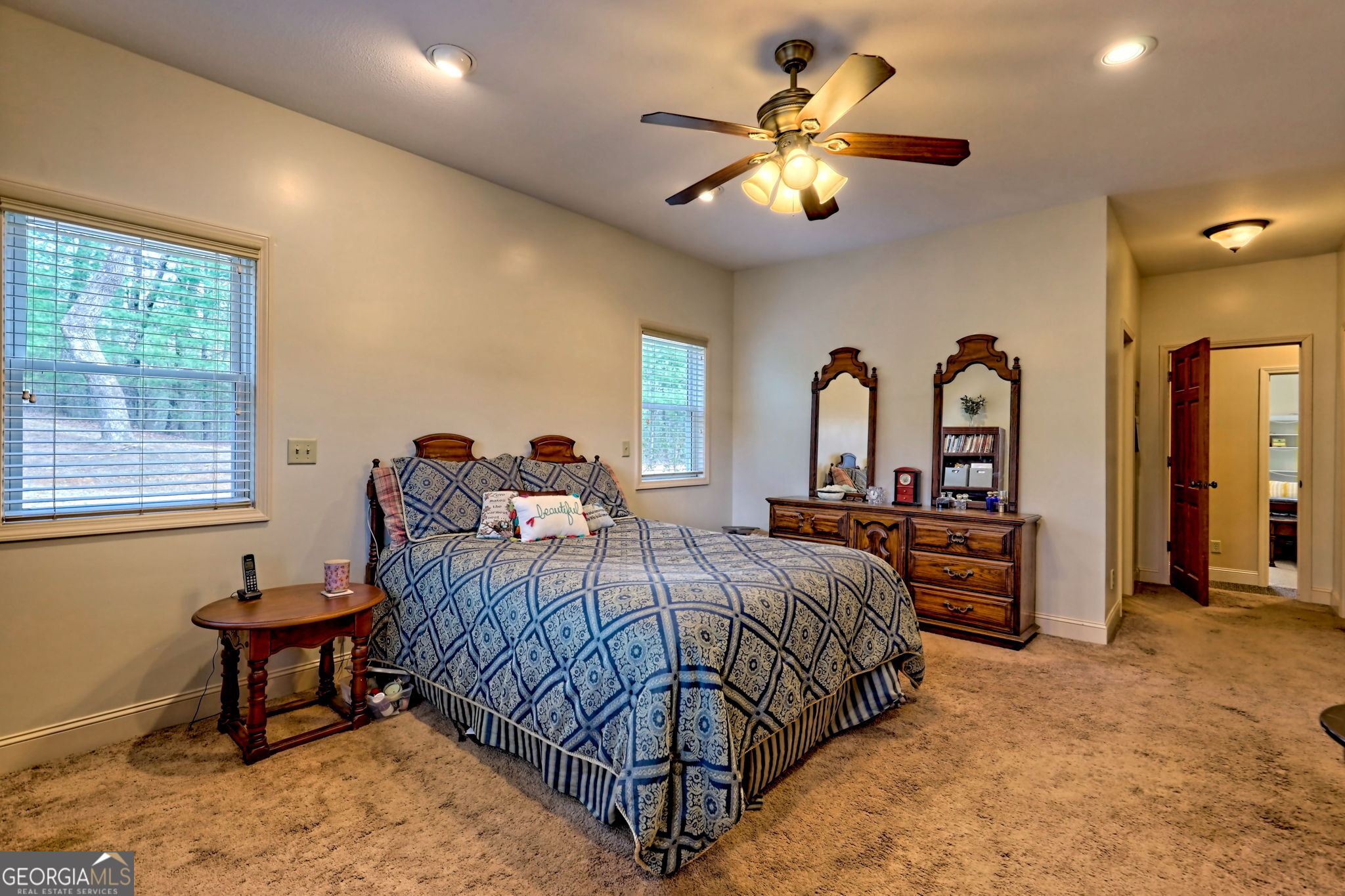 1068 Coleman River Road Clayton, GA 30525 - Photo 37 of 90 a bedroom with bed and a chandelier