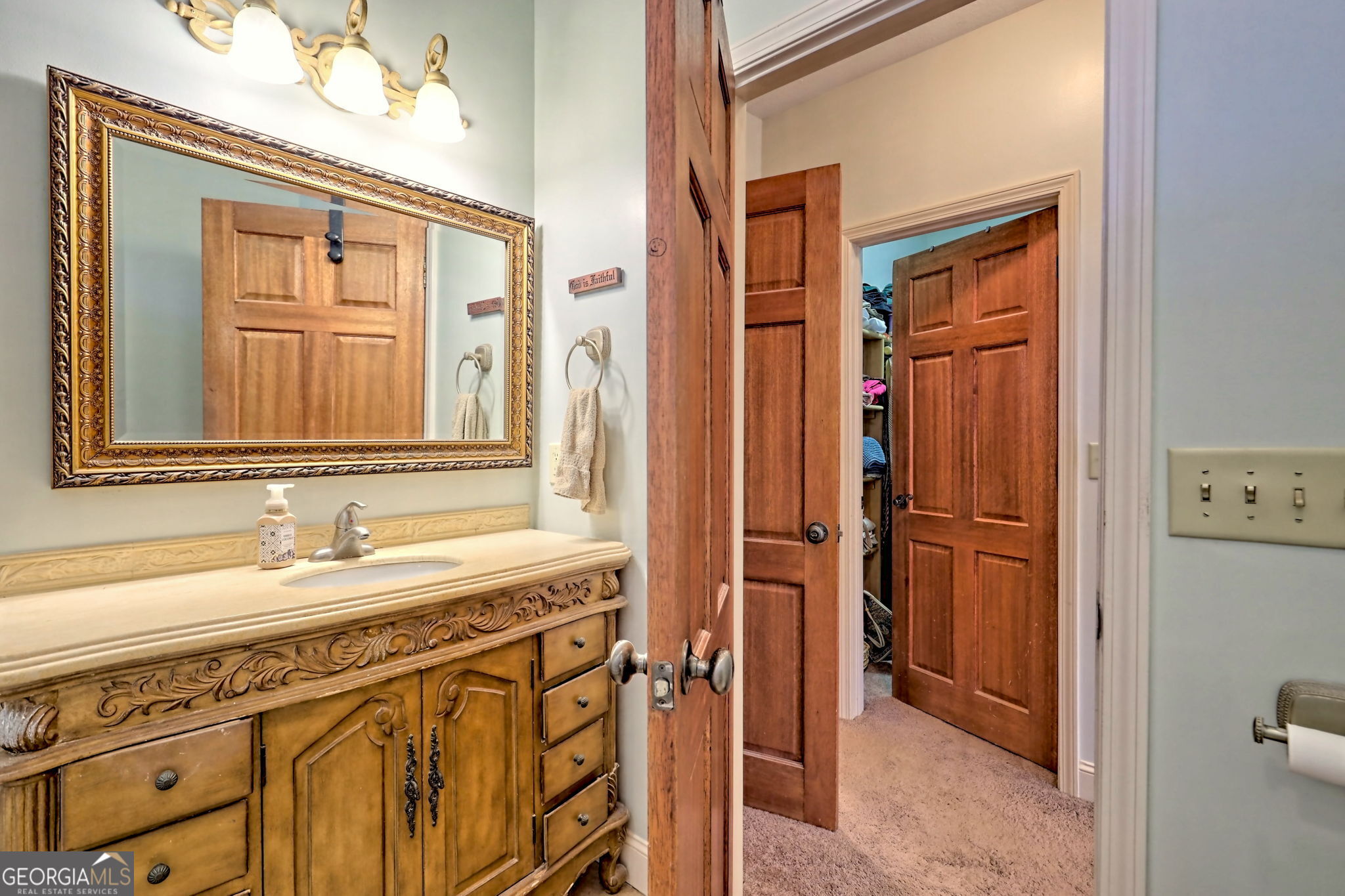 1068 Coleman River Road Clayton, GA 30525 - Photo 39 of 90 a bathroom with a sink a vanity and a mirror