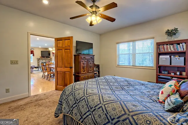 a view of a backyard with large trees