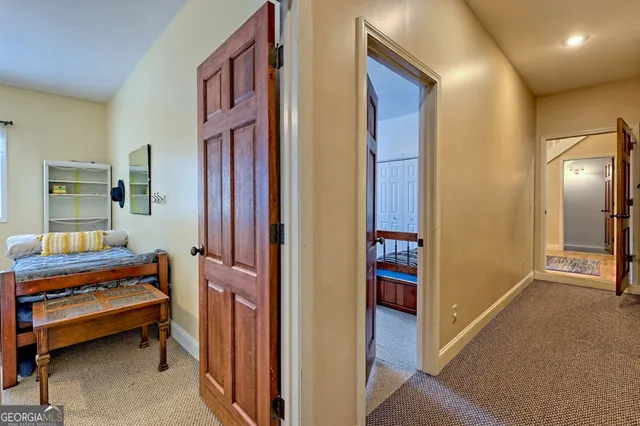 a view of a house with wooden fence