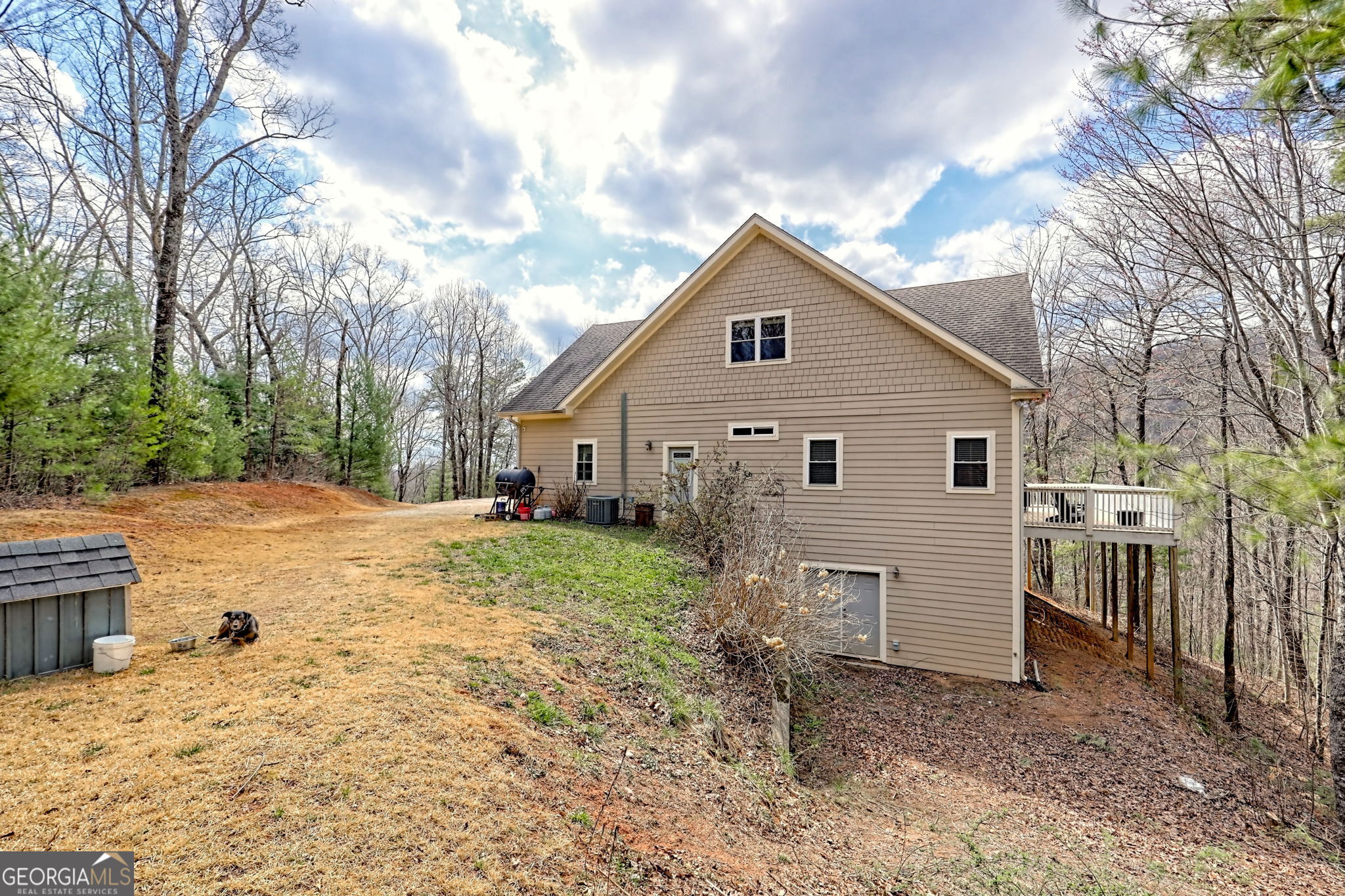 1068 Coleman River Road Clayton, GA 30525 - Photo 69 of 86 a view of a house with a yard covered in snow