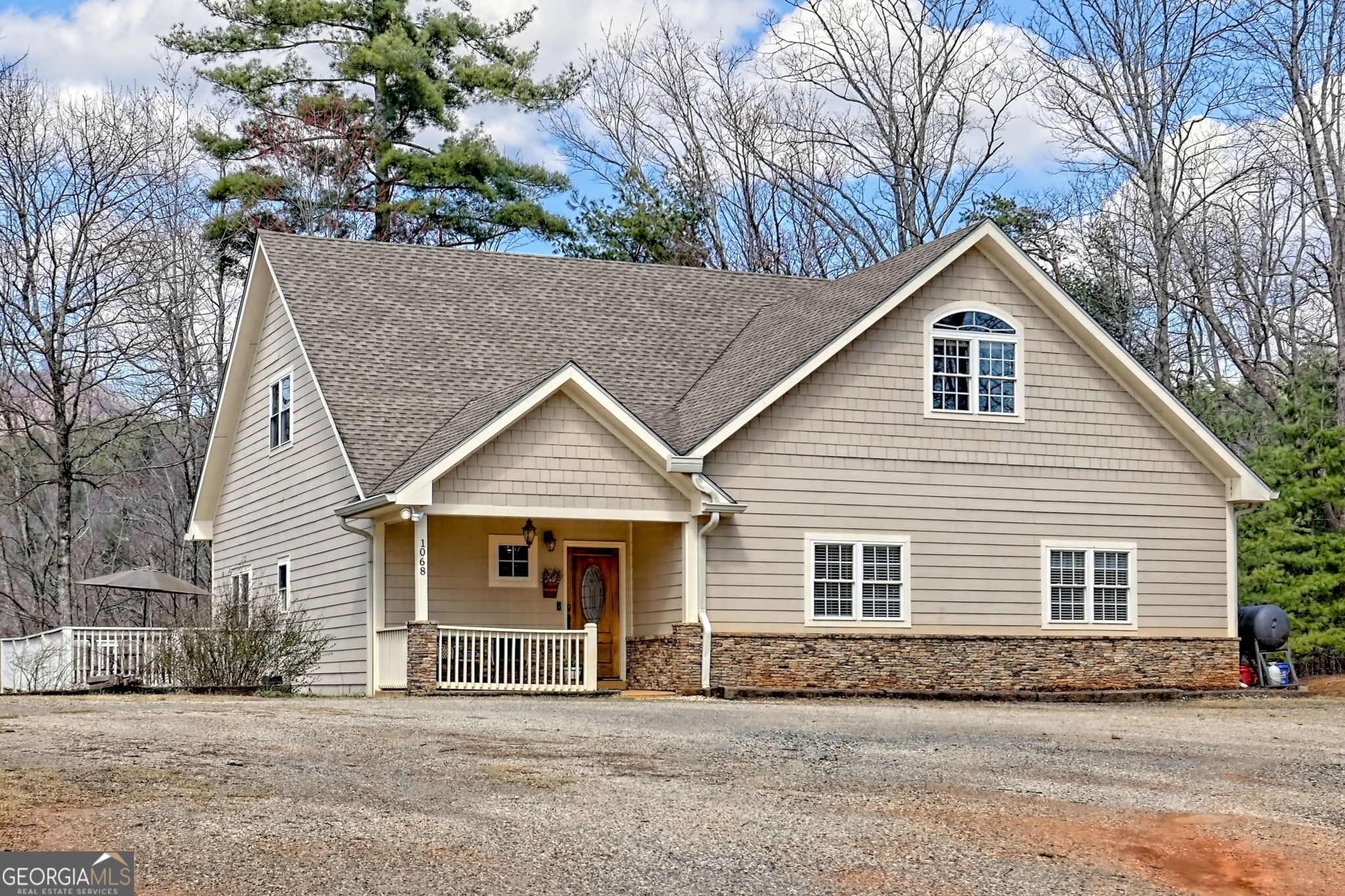1068 Coleman River Road Clayton, GA 30525 - Photo 9 of 90 a front view of a house with a garden
