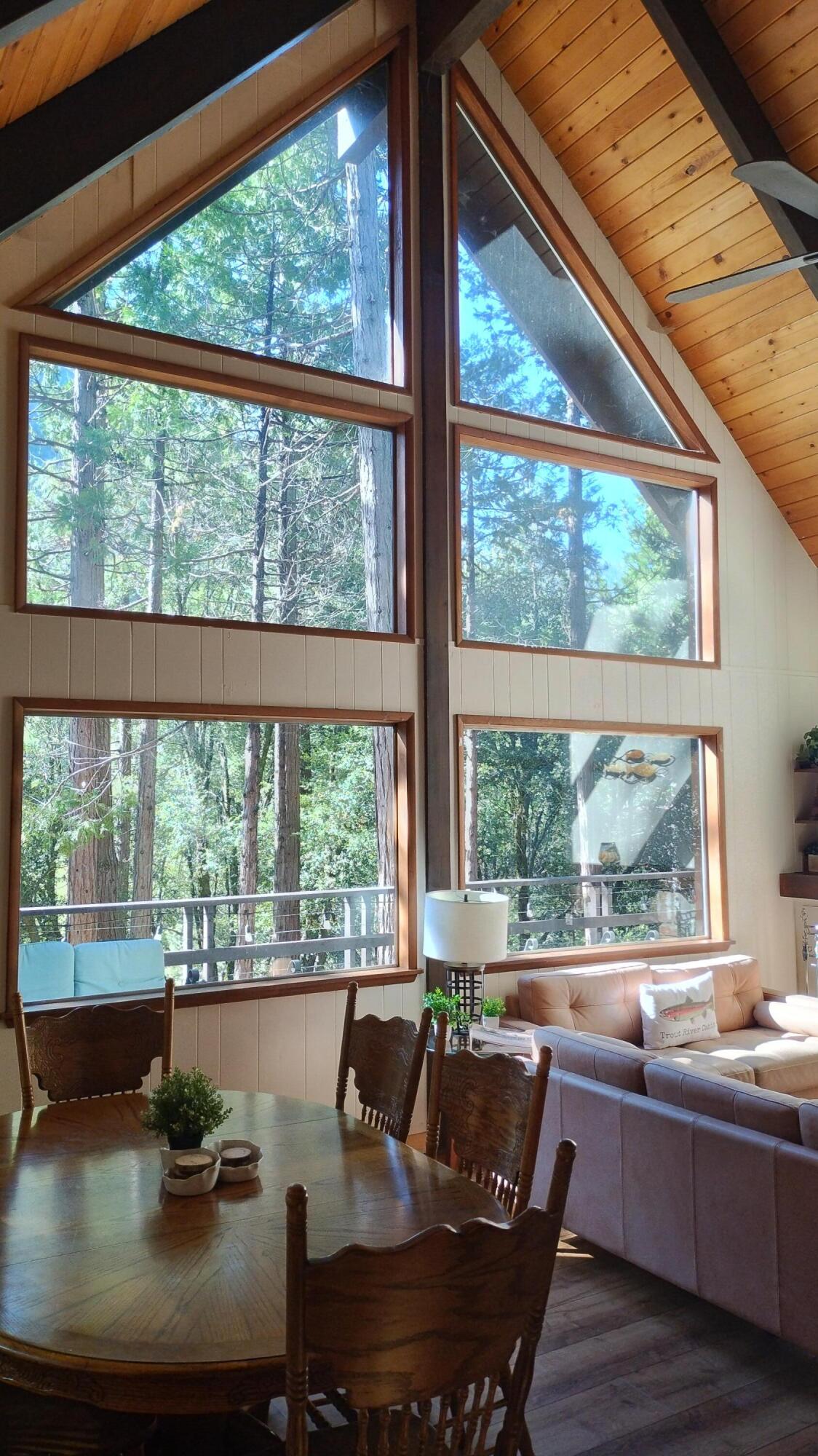 1693 Forest Rte 21S94 Camp Nelson, CA 93265 - Photo 5 of 86 a view of a dining room with furniture large windows and wooden floor