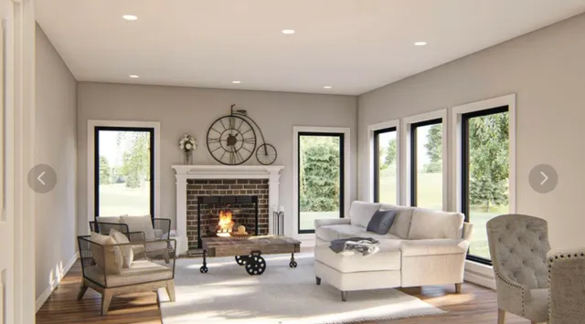 a living room with furniture a fireplace and a large window