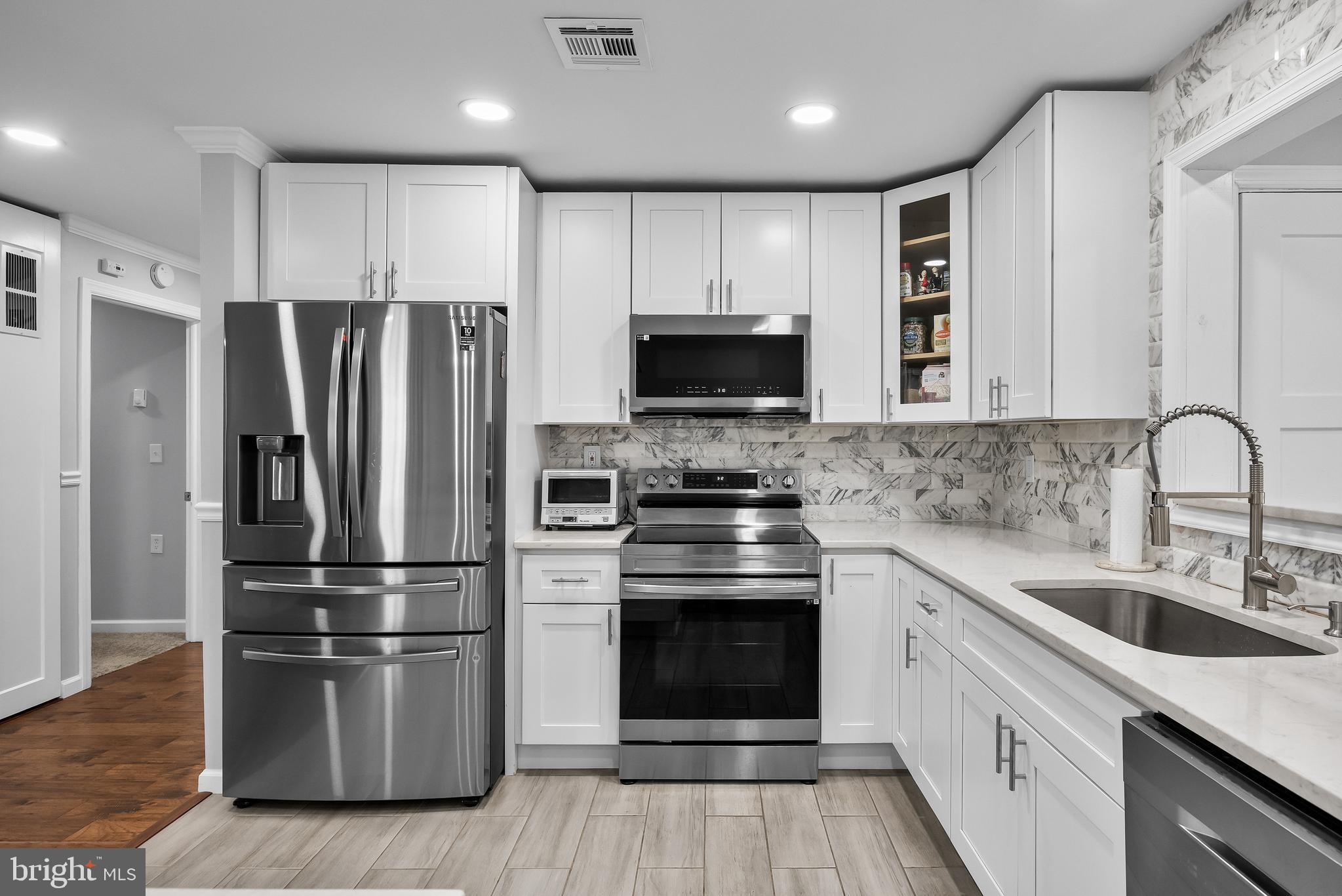 7 Picardy Place Southampton, NJ 08088 - Photo 11 of 26 a kitchen with wooden cabinets and stainless steel appliances