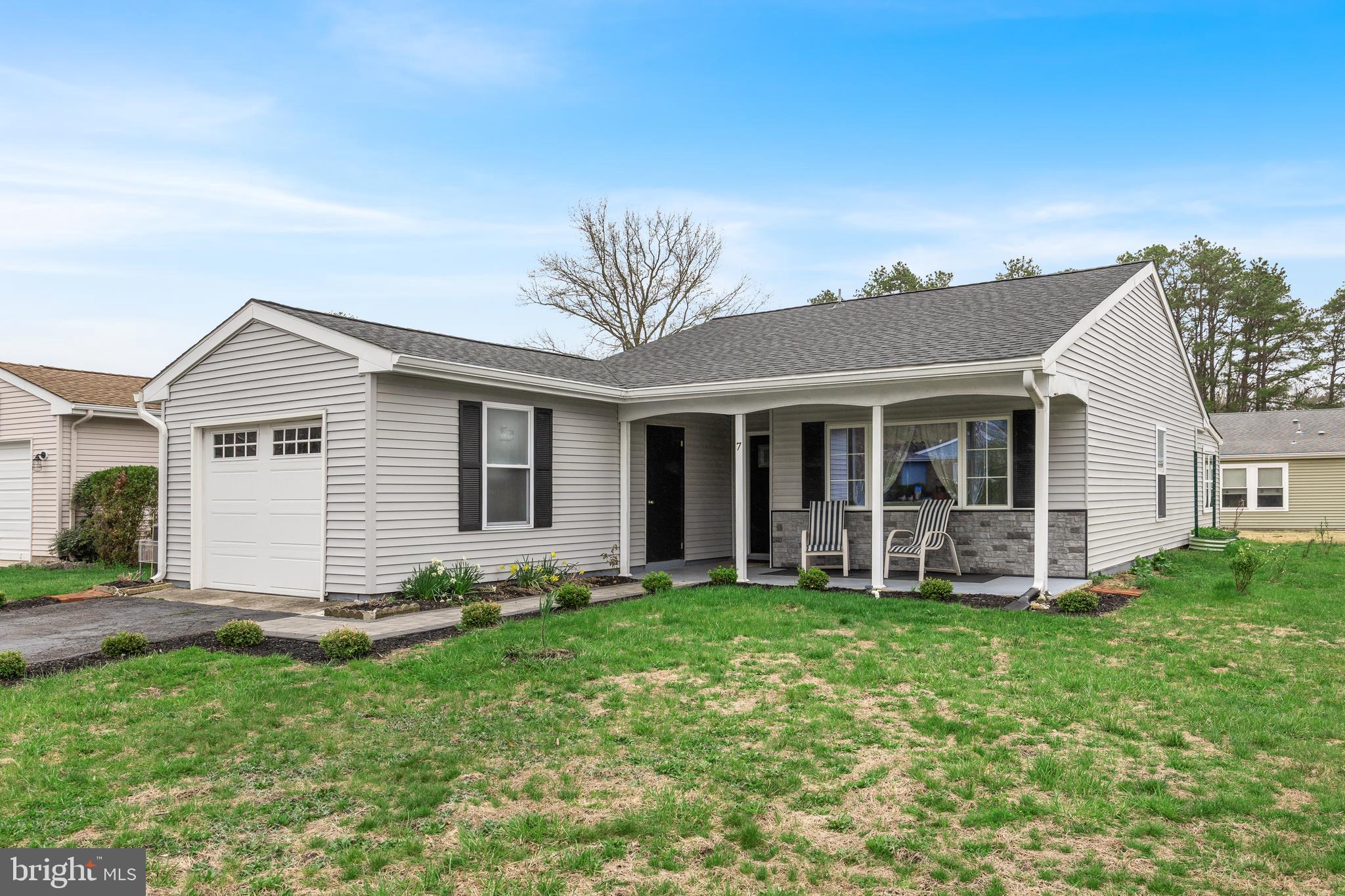 7 Picardy Place Southampton, NJ 08088 - Photo 2 of 26 a front view of a house with a yard and porch