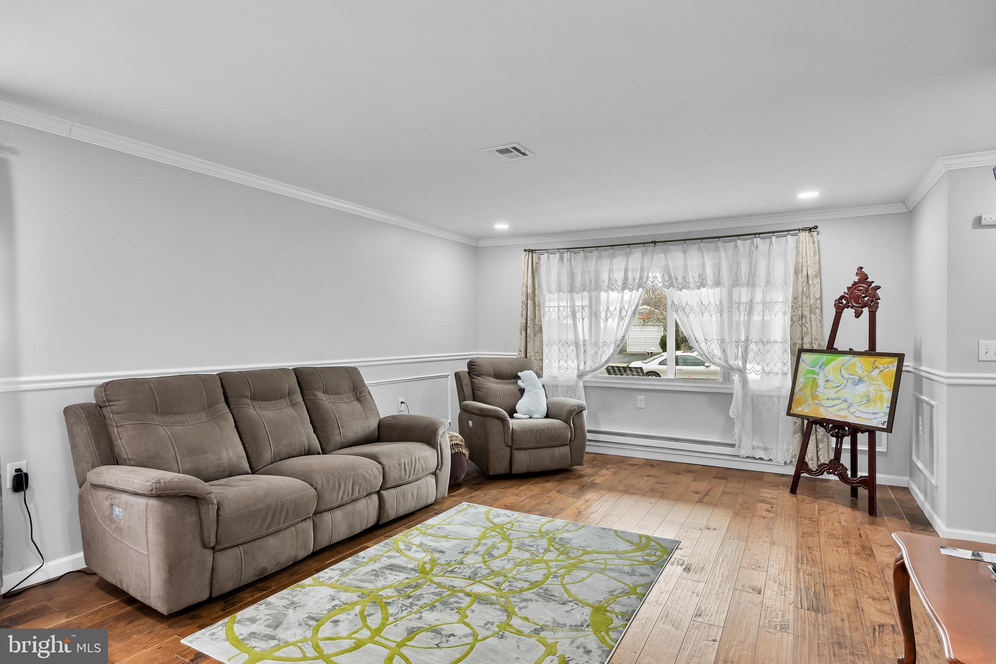 7 Picardy Place Southampton, NJ 08088 - Photo 6 of 26 a living room with furniture and a wooden floor