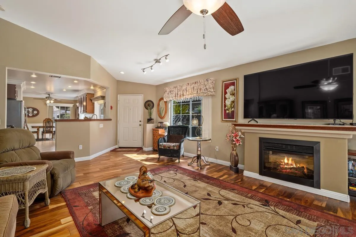 2516 Columbine Road Alpine, CA 91901 - Photo 13 of 33 a living room with furniture a flat screen tv and a fireplace