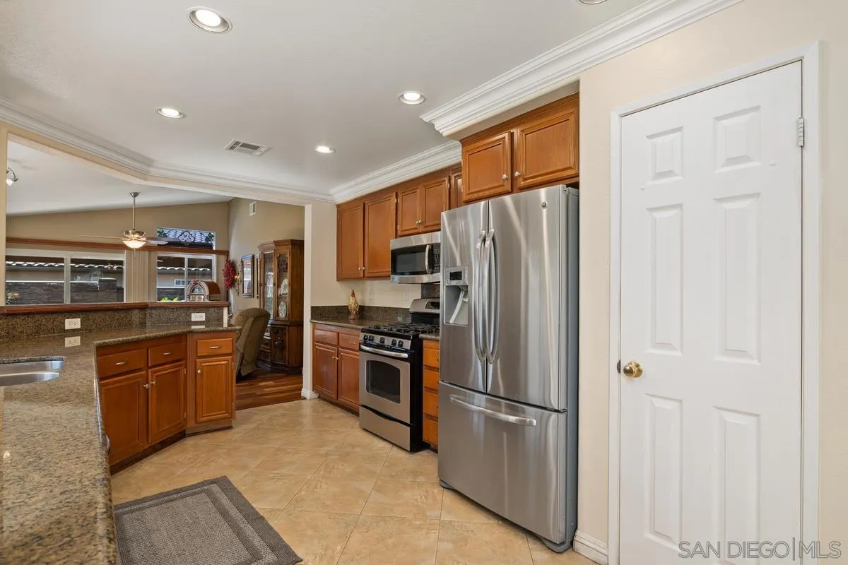 2516 Columbine Road Alpine, CA 91901 - Photo 17 of 33 a kitchen with stainless steel appliances granite countertop a refrigerator and a stove top oven