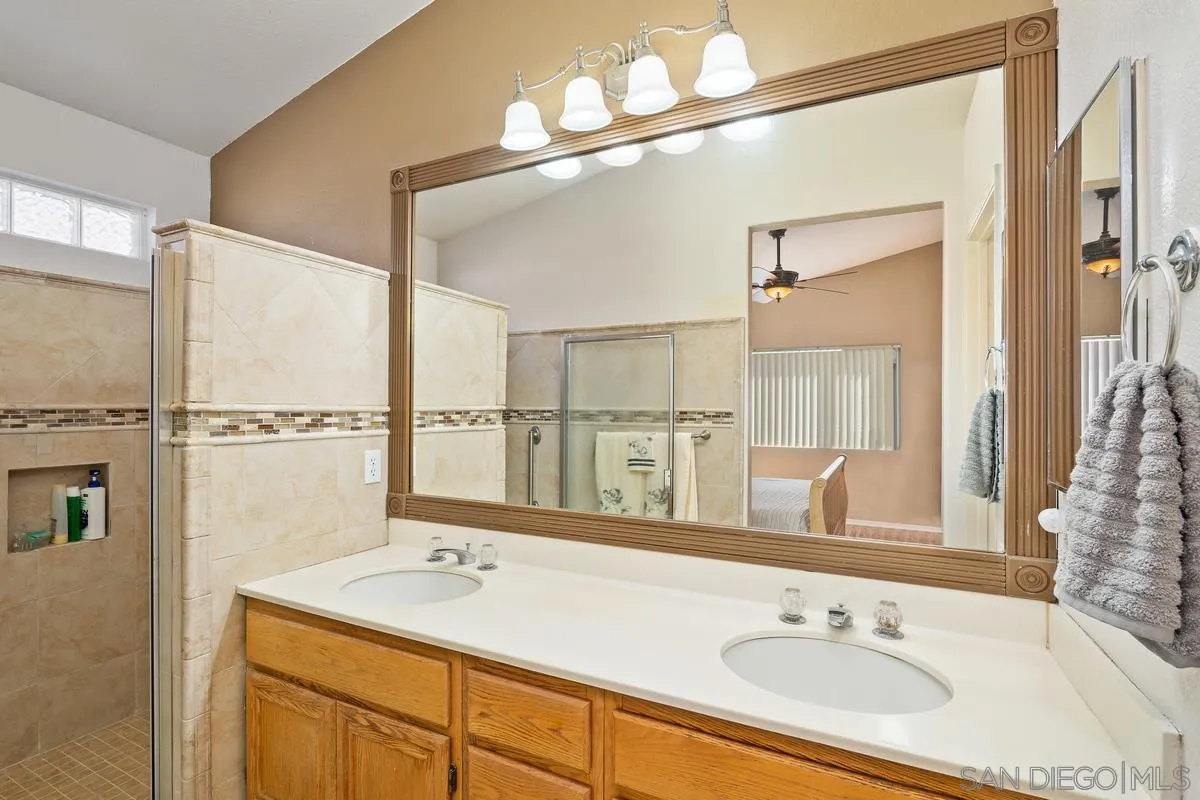 2516 Columbine Road Alpine, CA 91901 - Photo 20 of 33 a bathroom with a sink and a mirror