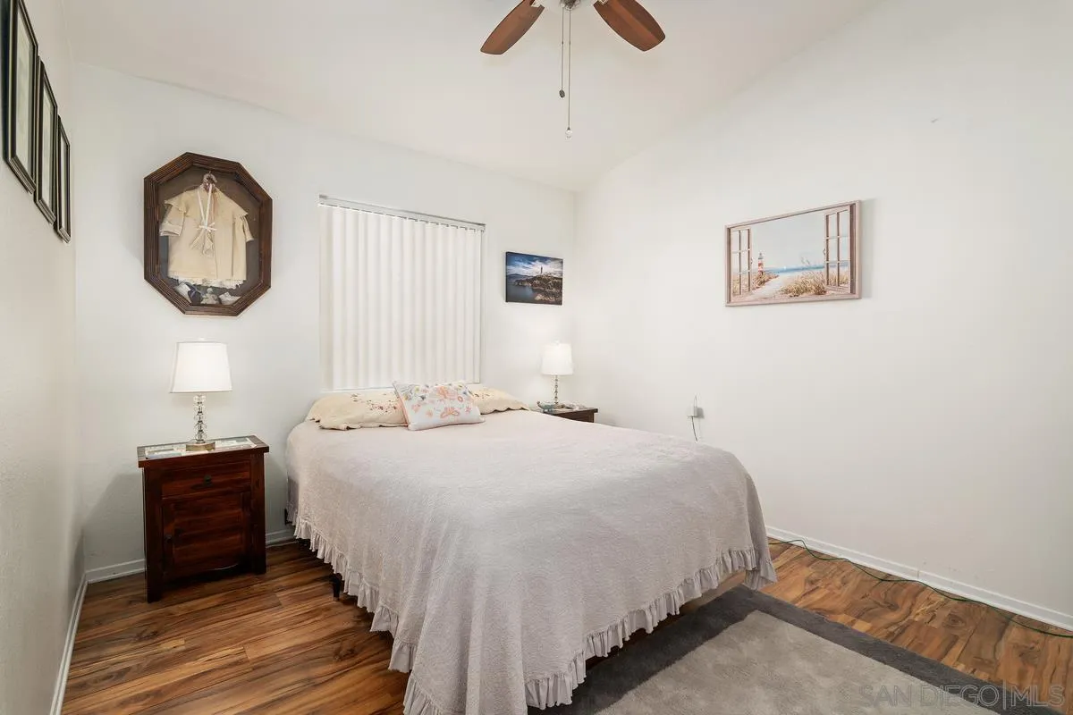 2516 Columbine Road Alpine, CA 91901 - Photo 22 of 33 a bedroom with a bed and a chandelier