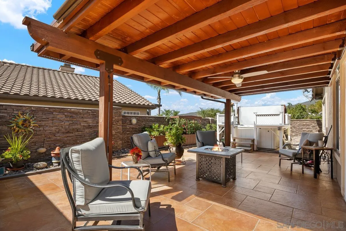 2516 Columbine Road Alpine, CA 91901 - Photo 24 of 33 a view of a patio with table and chairs potted plants with floor to ceiling window and potted plants