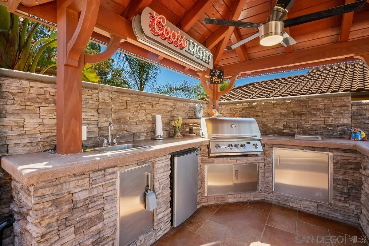 2516 Columbine Road Alpine, CA 91901 - Photo 8 of 33 a kitchen with stainless steel appliances granite countertop a stove and a sink