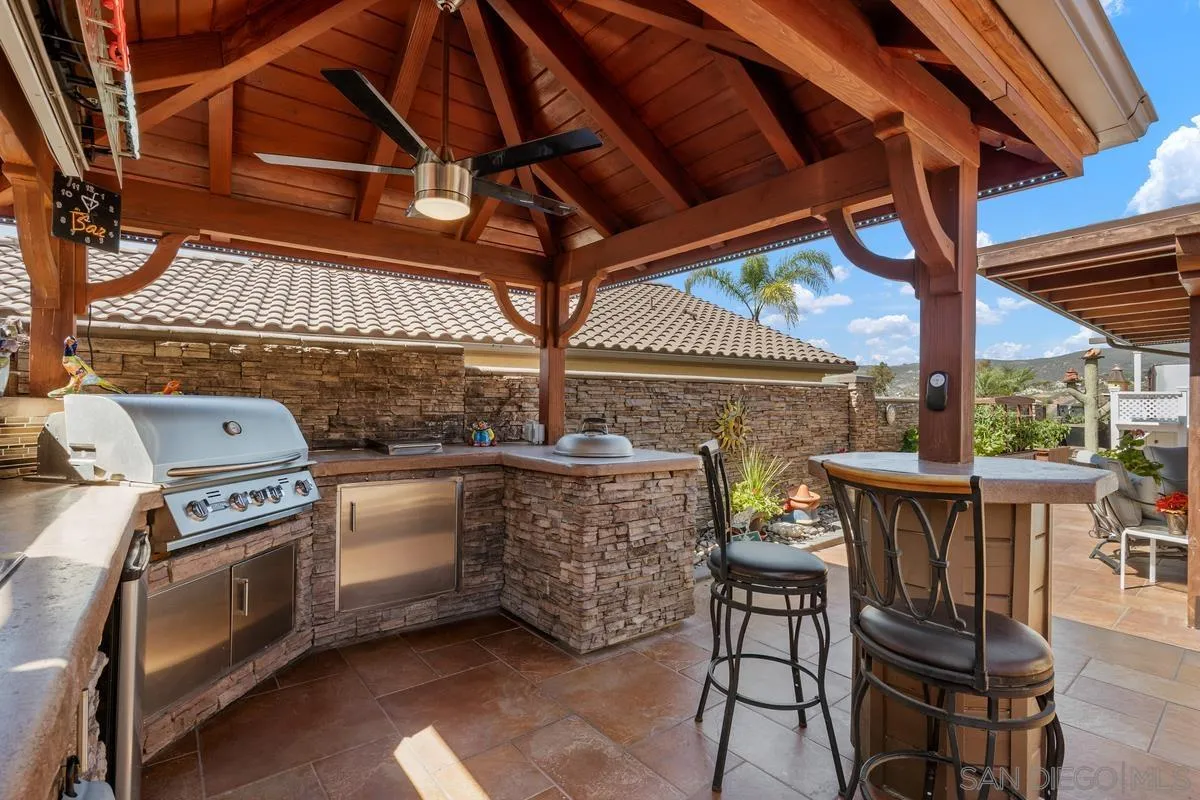 2516 Columbine Road Alpine, CA 91901 - Photo 9 of 33 a view of a patio with table and chairs with wooden floor