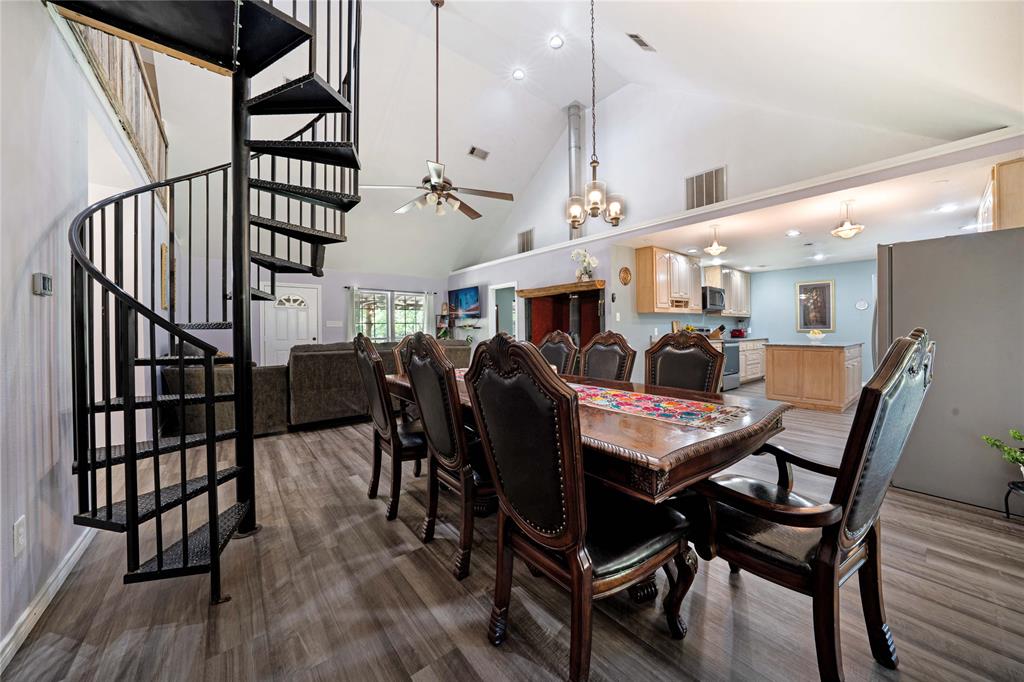 1511 North Walnut Grove Road Midlothian, TX 76065 - Photo 11 of 39 a view of a dining room with furniture and wooden floor