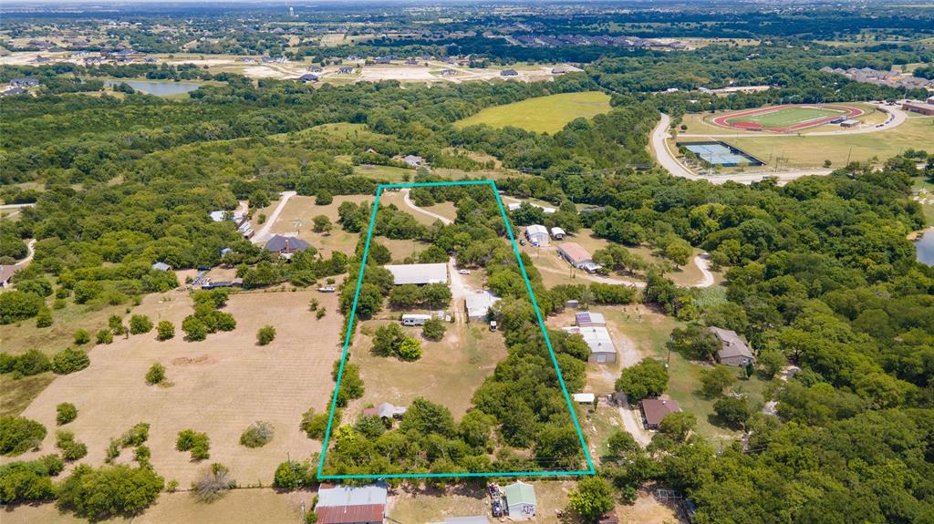 1511 North Walnut Grove Road Midlothian, TX 76065 - Photo 2 of 39 an aerial view of residential houses with outdoor space