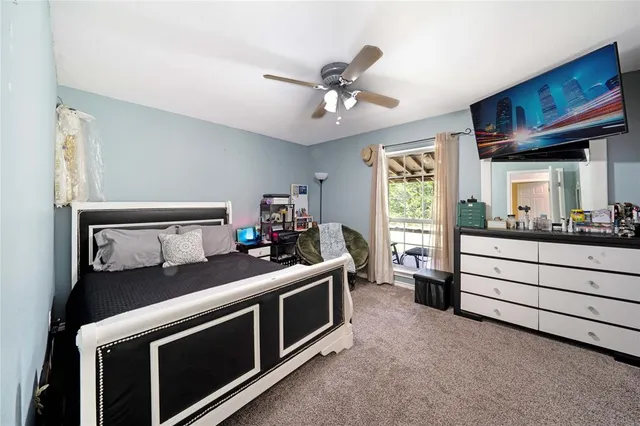 a bed room with a bed and a window