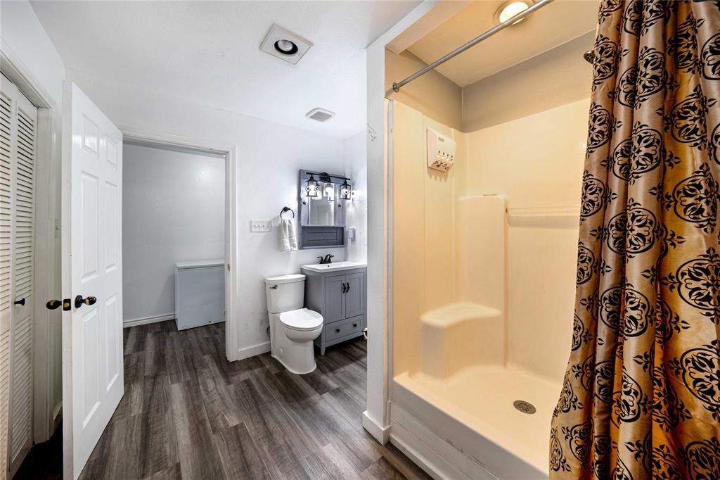 1511 North Walnut Grove Road Midlothian, TX 76065 - Photo 24 of 39 a bathroom with a sink toilet and shower