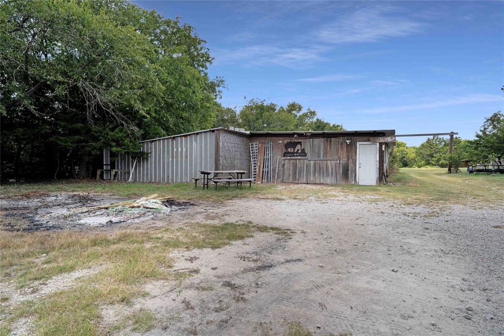 1511 North Walnut Grove Road Midlothian, TX 76065 - Photo 35 of 39 a front view of a house with a yard