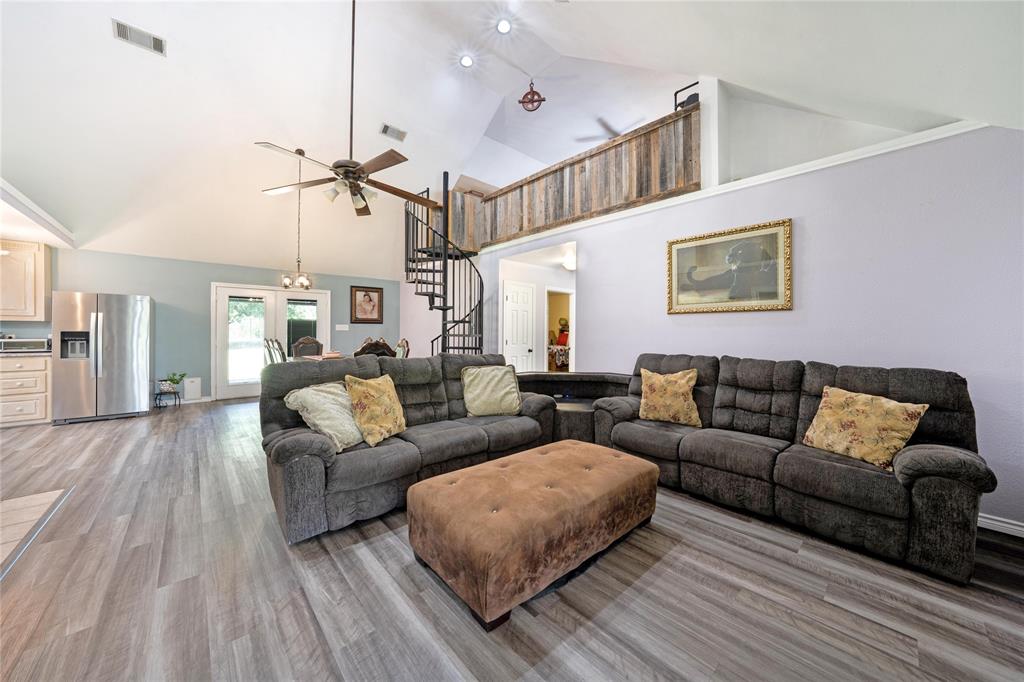 1511 North Walnut Grove Road Midlothian, TX 76065 - Photo 7 of 39 a living room with furniture and a ceiling fan