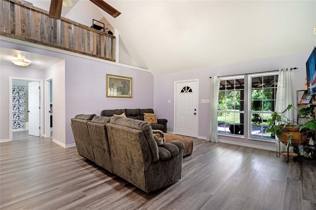 1511 North Walnut Grove Road Midlothian, TX 76065 - Photo 8 of 39 a living room with furniture and wooden floor