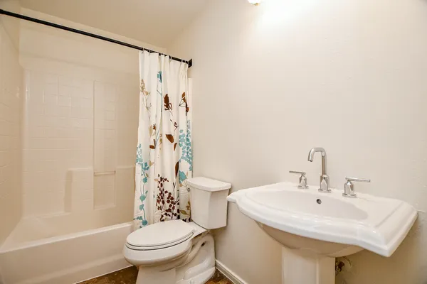 a bedroom with bed and a book shelf