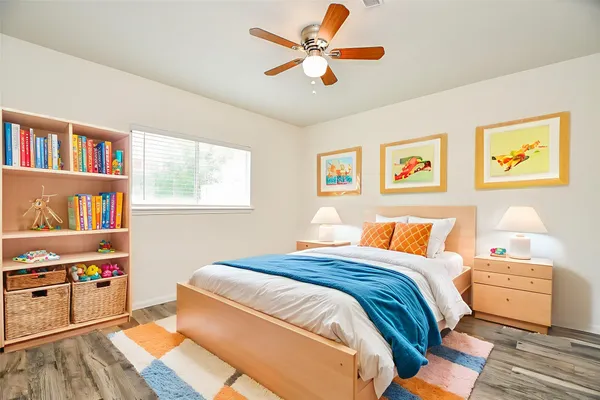 a bedroom with bed and a window