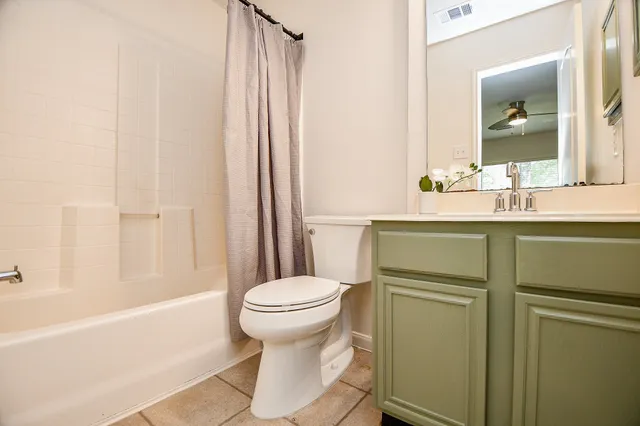 a view of a lake with houses in the background