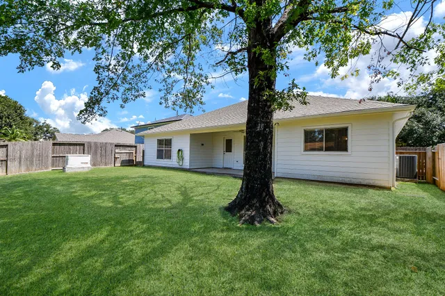 a view of a lake with houses in the back