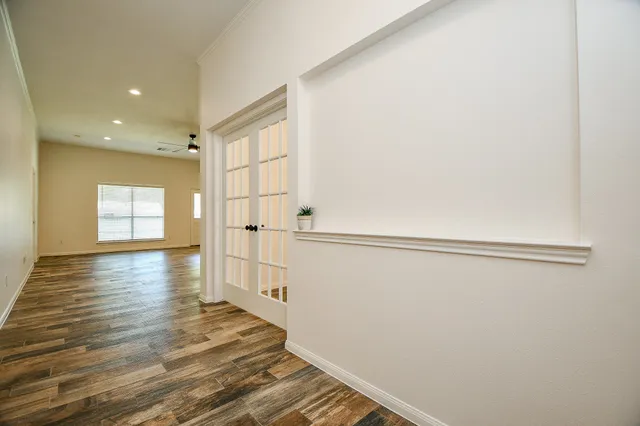 a view of a livingroom with wooden floor