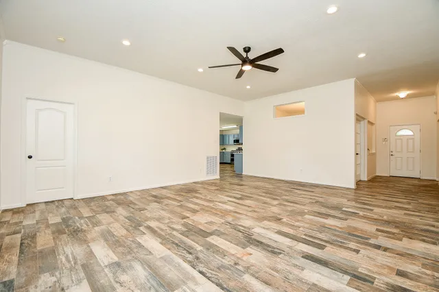 a kitchen with a sink refrigerator and cabinets