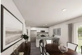 a kitchen with stainless steel appliances granite countertop a refrigerator a sink dishwasher a dining table and chairs with wooden floor