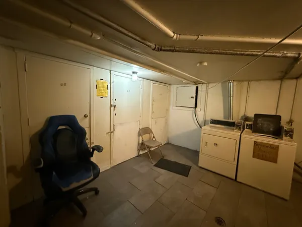 a kitchen with a refrigerator and cabinets