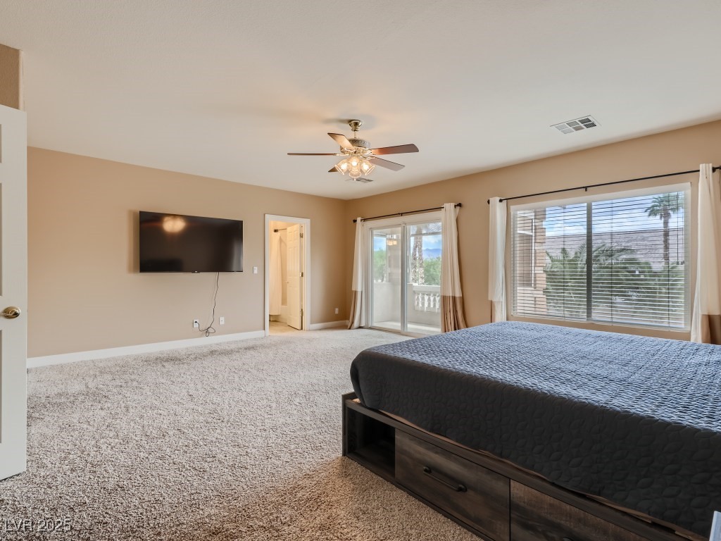1221 Fragrant Spruce Avenue Las Vegas, NV 89123 - Photo 38 of 59 Primary bedroom with carpet, full bathroom, access to exterior balcony, and a ceiling fan with light