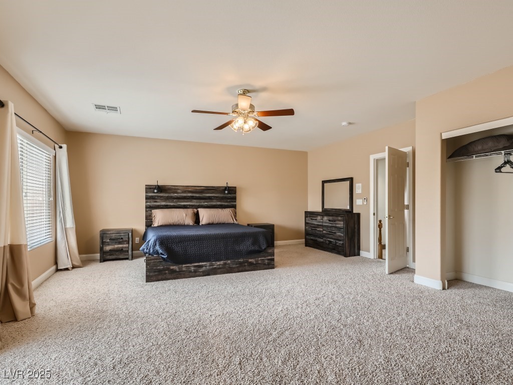 1221 Fragrant Spruce Avenue Las Vegas, NV 89123 - Photo 41 of 59 Primary bedroom with carpet, full bathroom, closet, access to exterior balcony, and a ceiling fan with light