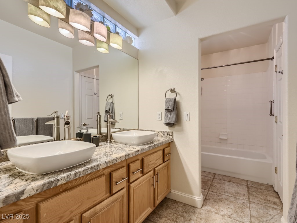 1221 Fragrant Spruce Avenue Las Vegas, NV 89123 - Photo 44 of 59 Bathroom with double vanity, shower combination, and light tile patterned floors