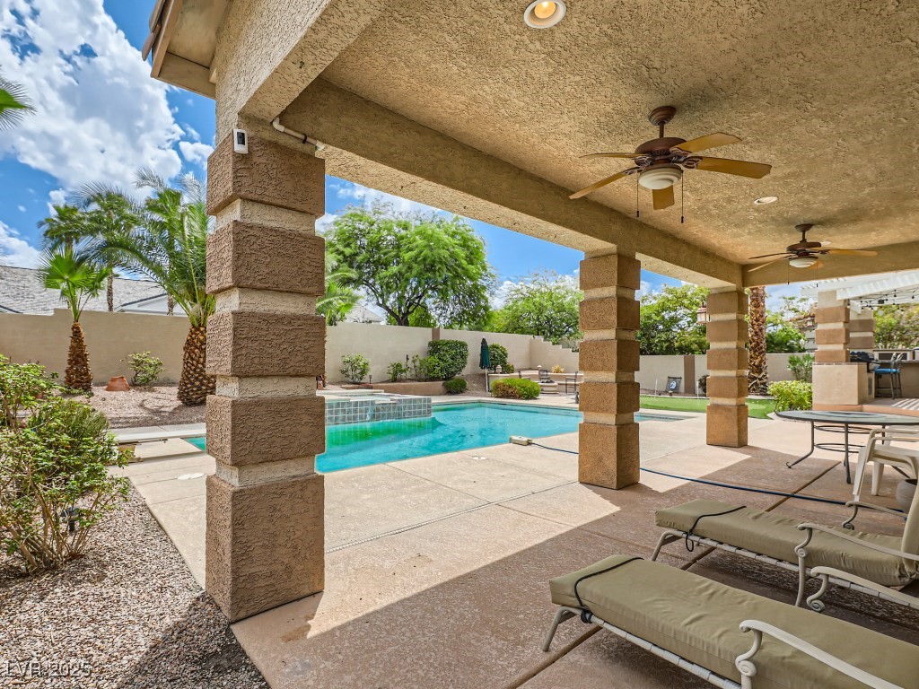 1221 Fragrant Spruce Avenue Las Vegas, NV 89123 - Photo 48 of 59 Fenced backyard with a patio and a ceiling fan with light