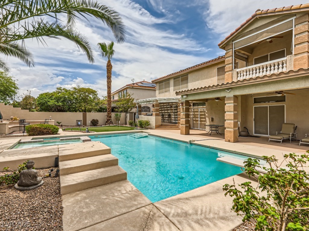 1221 Fragrant Spruce Avenue Las Vegas, NV 89123 - Photo 50 of 59 View of swimming pool featuring a ceiling fan, a patio area, a balcony, and a fenced backyard