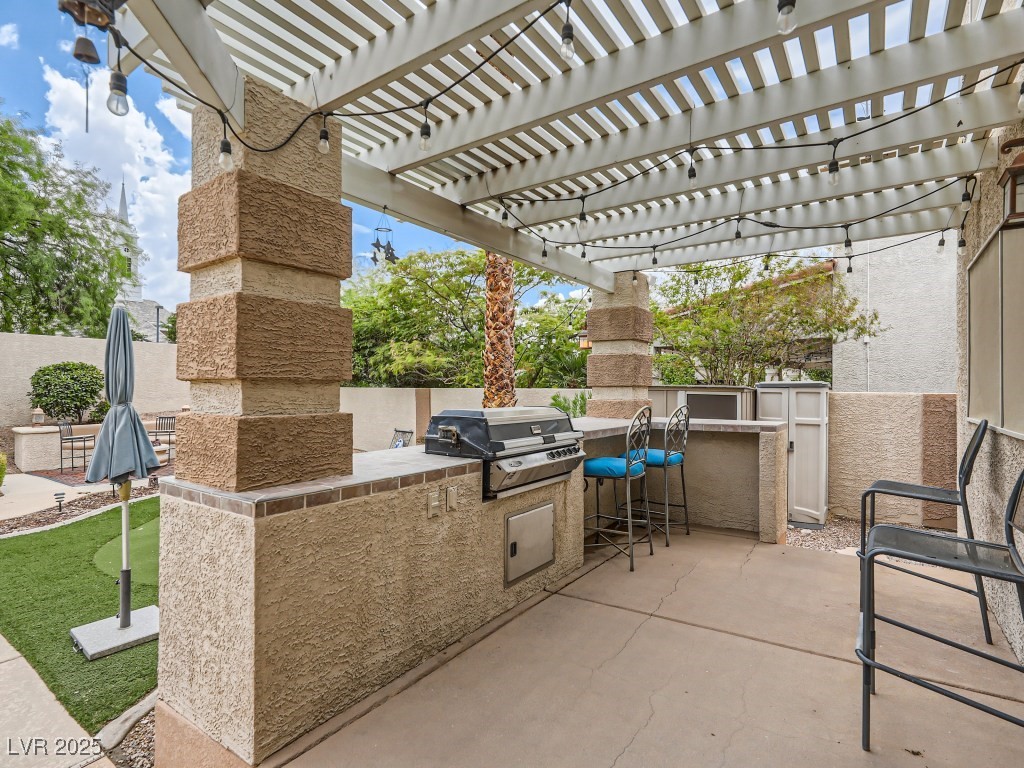 1221 Fragrant Spruce Avenue Las Vegas, NV 89123 - Photo 55 of 59 View of patio featuring exterior kitchen and a pergola