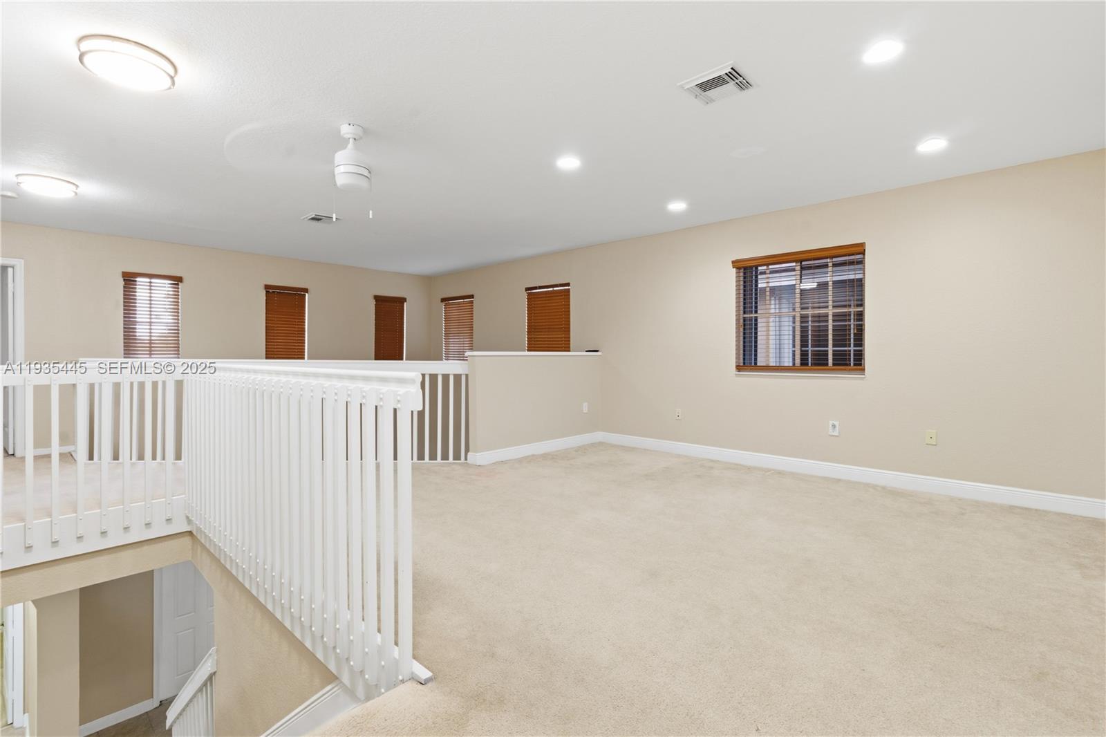 27049 Southwest 142nd Avenue Homestead, FL 33032 - Photo 15 of 36 an empty room with windows and cabinet