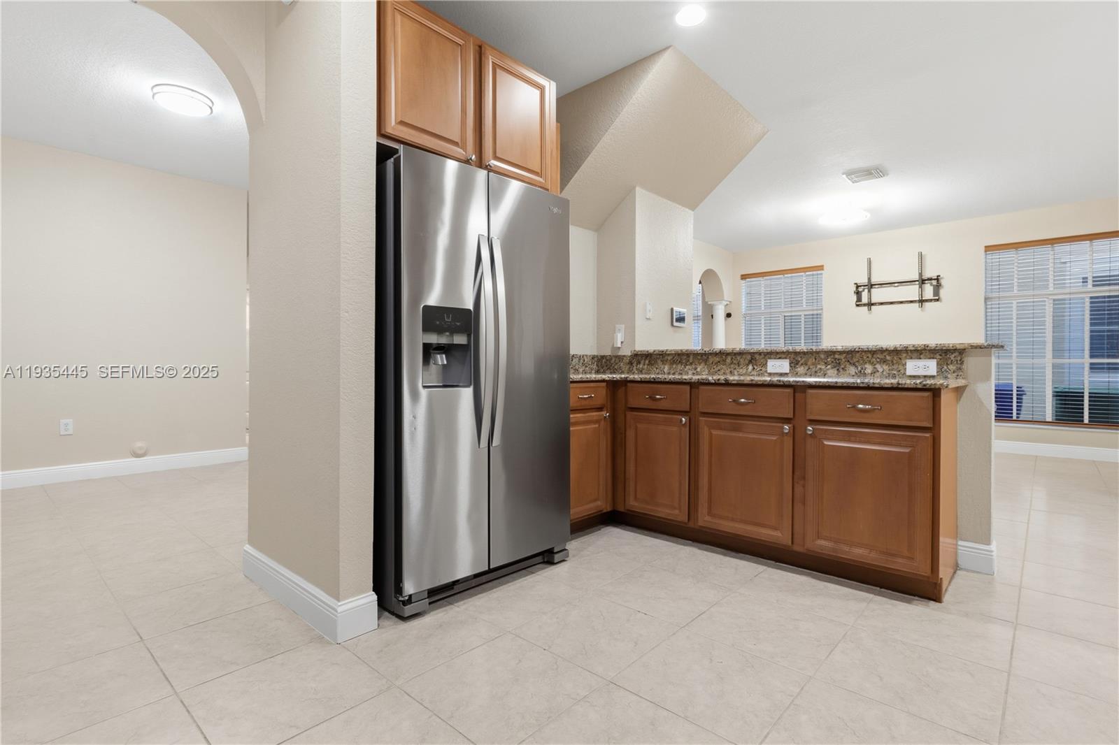 27049 Southwest 142nd Avenue Homestead, FL 33032 - Photo 20 of 36 a kitchen with stainless steel appliances granite countertop a refrigerator and a sink