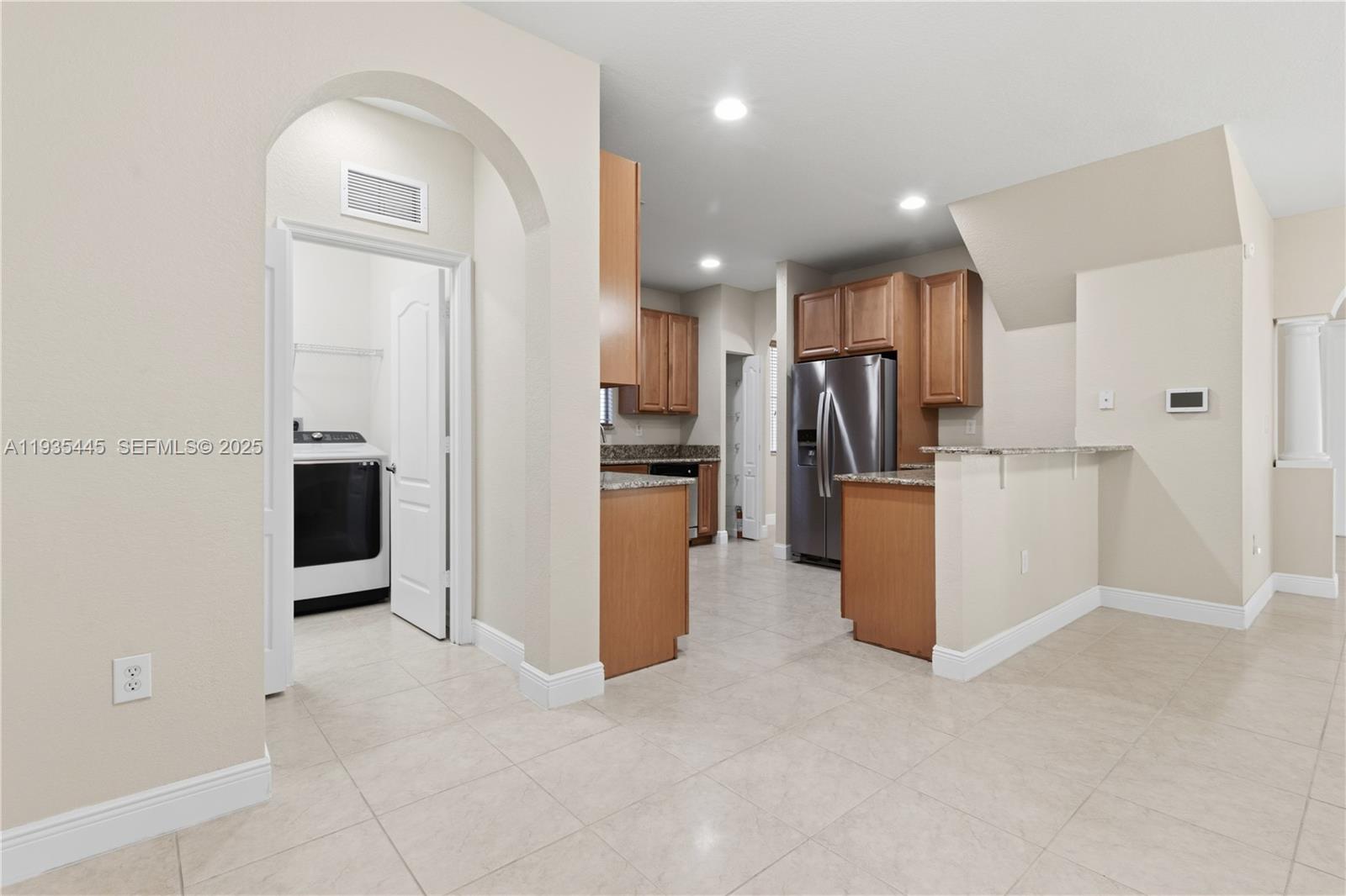 27049 Southwest 142nd Avenue Homestead, FL 33032 - Photo 26 of 36 a view of a kitchen with refrigerator and a sink