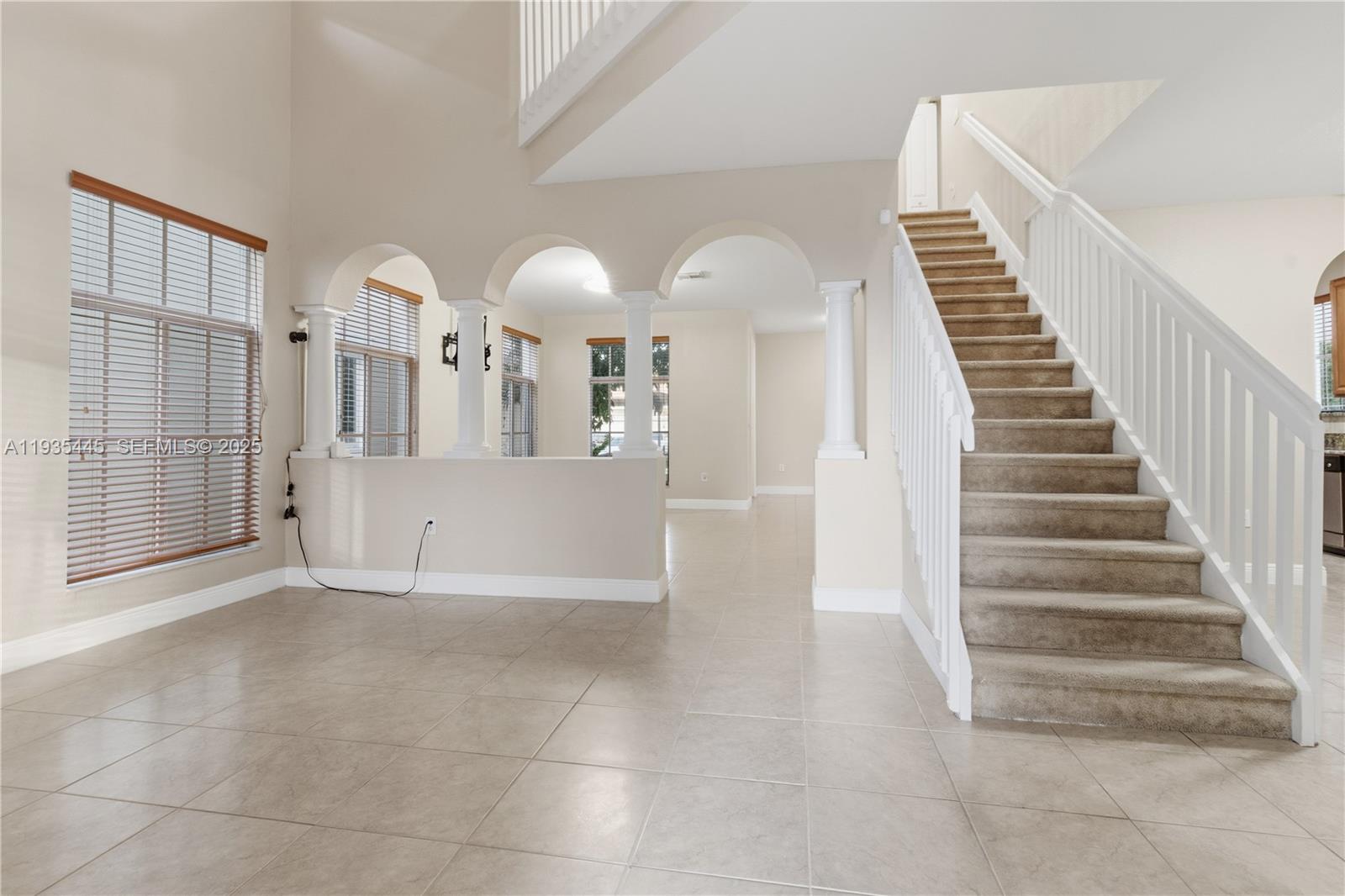 27049 Southwest 142nd Avenue Homestead, FL 33032 - Photo 30 of 36 a view of a hallway with entryway wooden floor and front door