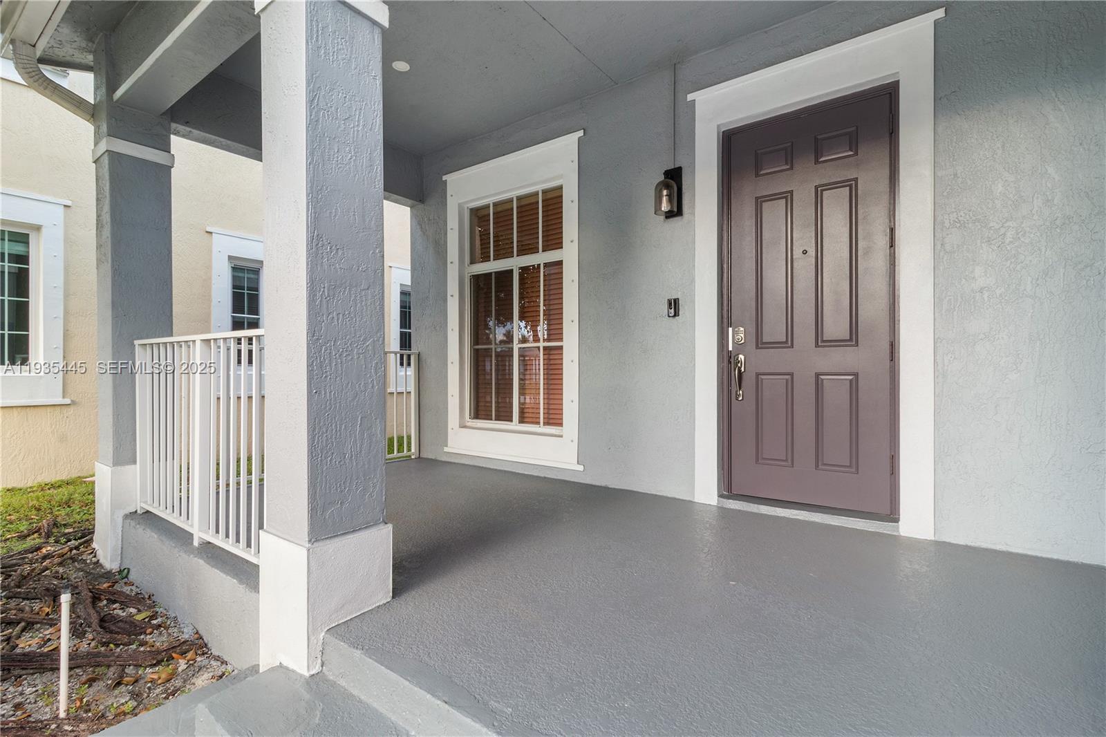 27049 Southwest 142nd Avenue Homestead, FL 33032 - Photo 3 of 36 an entryway with a livingroom