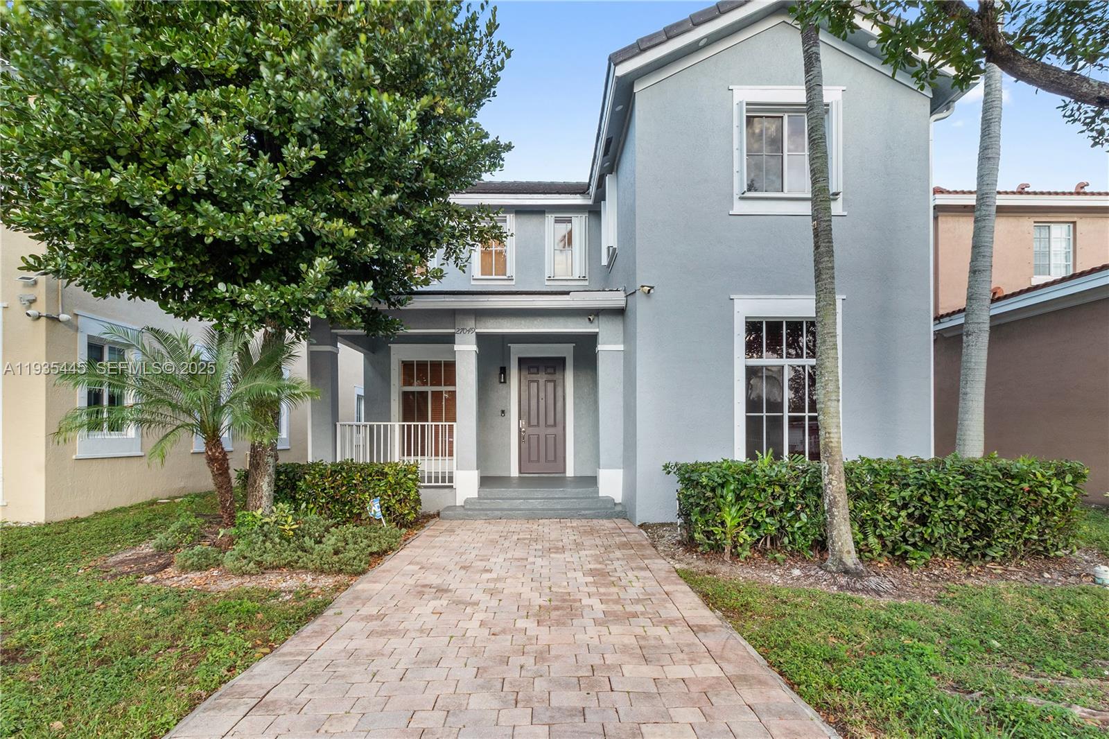 27049 Southwest 142nd Avenue Homestead, FL 33032 - Photo 4 of 36 front view of a house with a yard