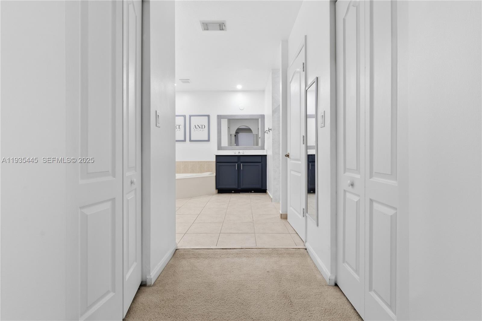 27049 Southwest 142nd Avenue Homestead, FL 33032 - Photo 7 of 36 a bathroom with a sink and mirror
