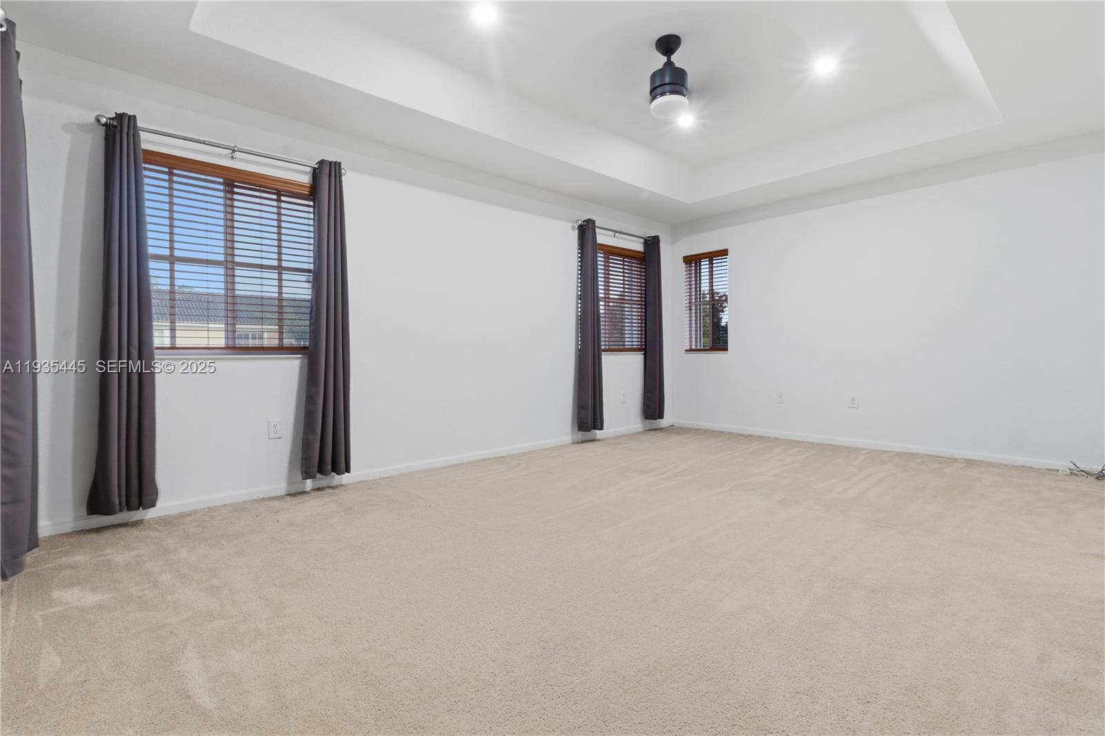 27049 Southwest 142nd Avenue Homestead, FL 33032 - Photo 8 of 36 a view of an empty room with a window